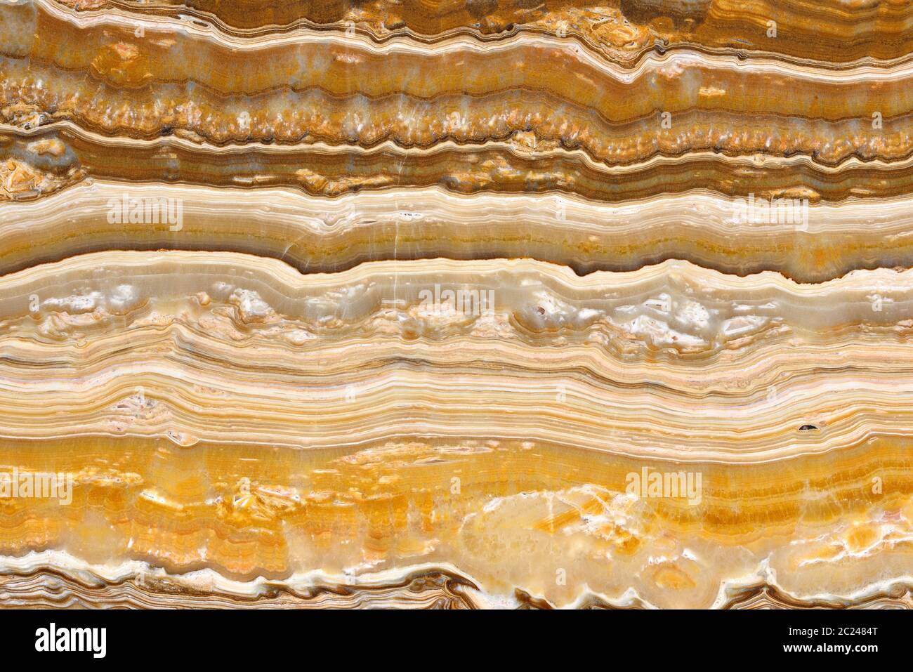 motif naturel de couleur beige onyx, tranche de minerai poli. Très haute  résolution. ONYX oignon Empire Or Photo Stock - Alamy