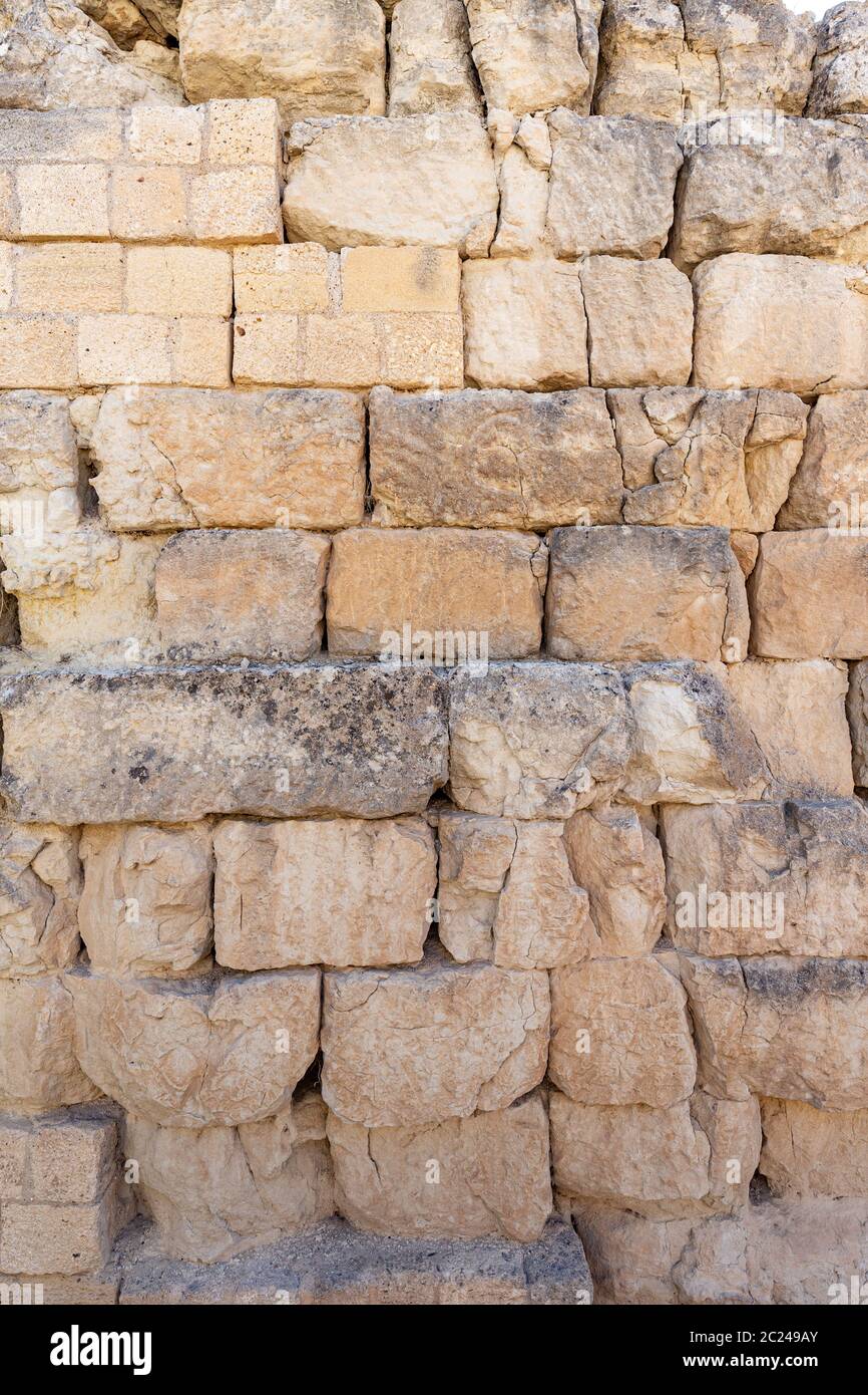 Arrière-plan d'un mur fait de briques en pierre Banque D'Images