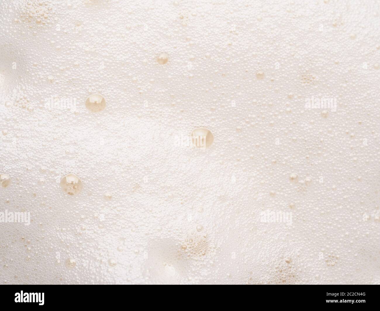 Mousse de bière ou de cappuccino avec texture de bulles Banque D'Images