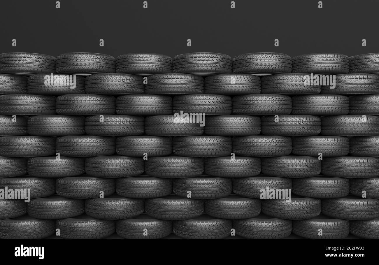 Un tas de pneus de voiture se trouvent sur un fond noir. Maquette pour publicité de l'installation de pneus ou de l'entretien automatique. Rendu 3D. Banque D'Images