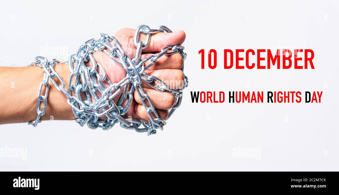 Poing enchaînés avec les mains 10 décembre Journée des droits de l'homme monde texte sur fond blanc, la Journée des droits de l'concept Banque D'Images