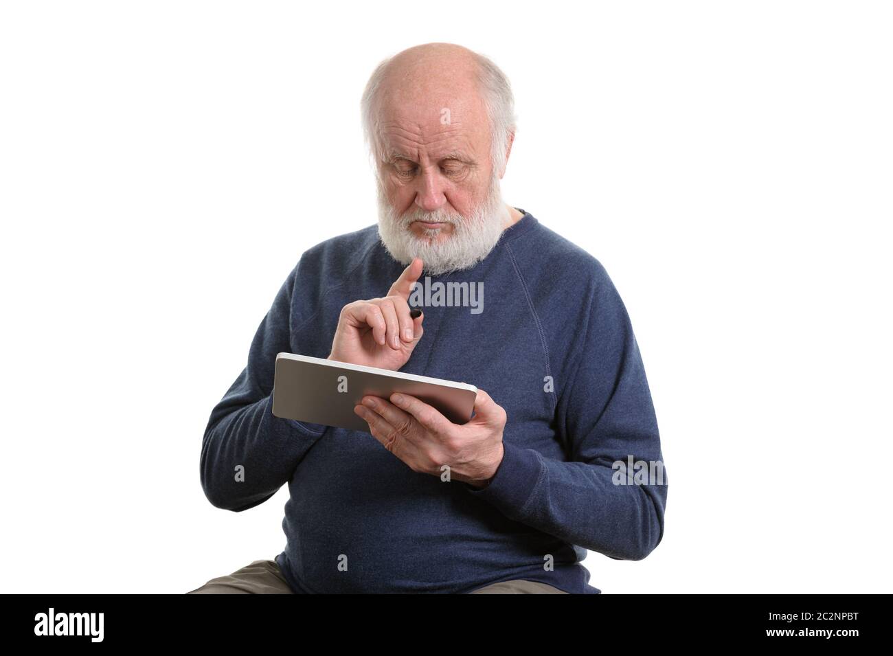 Funny old man using tablet computer isolated on white Banque D'Images