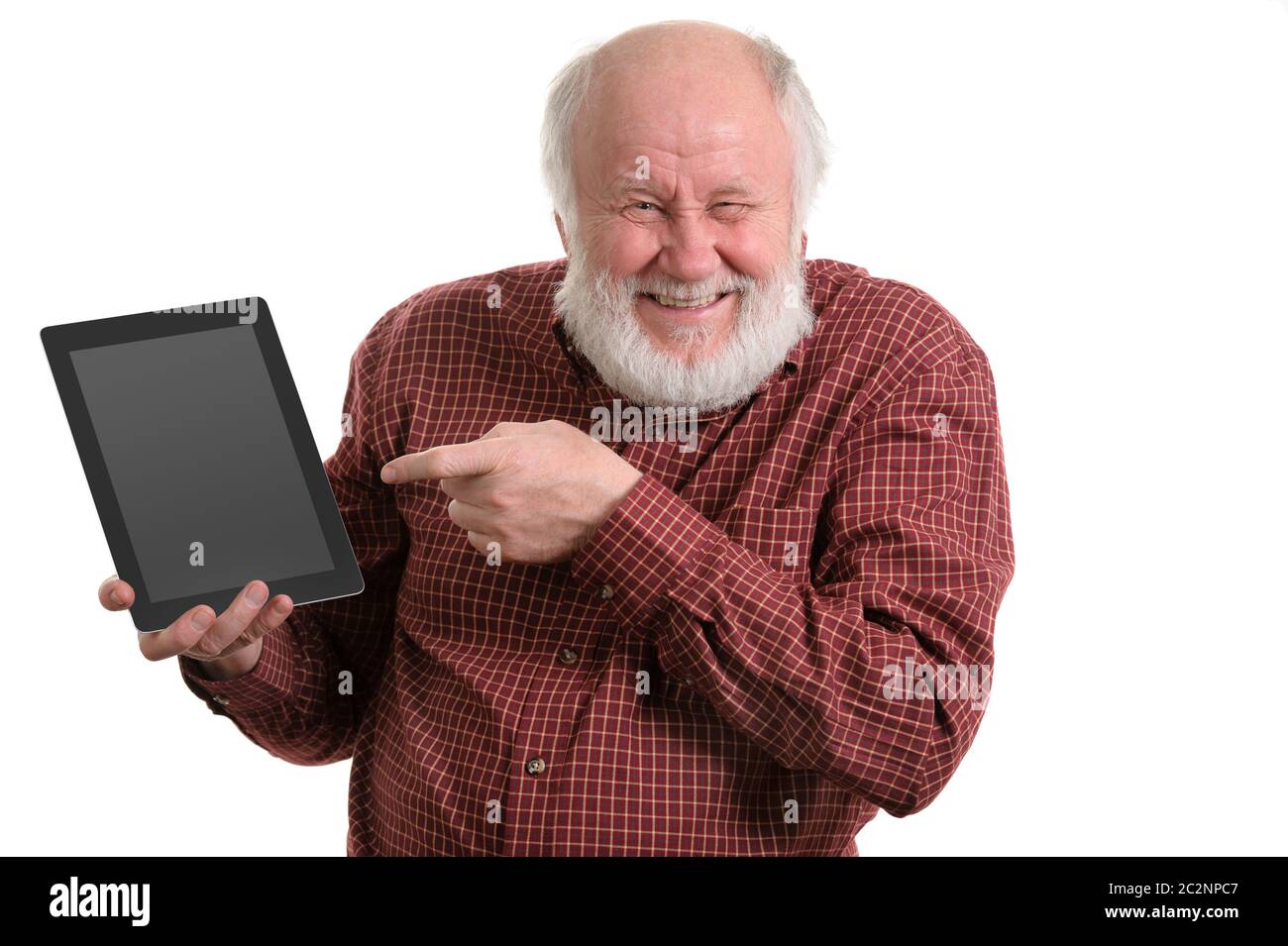 Funny old man using tablet computer isolated on white Banque D'Images