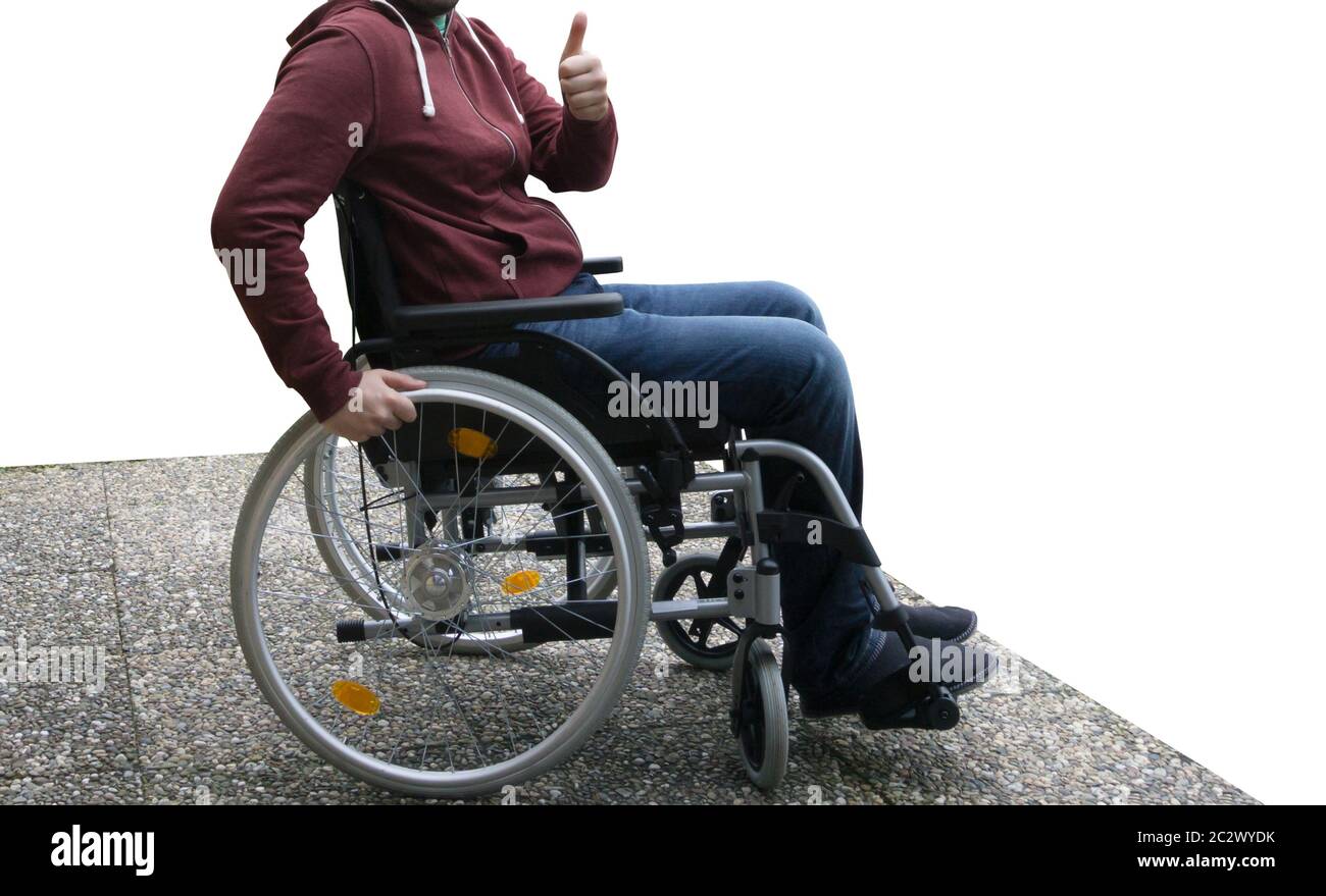 L'homme en fauteuil roulant sur dalle béton lavé, Thumbs up Banque D'Images