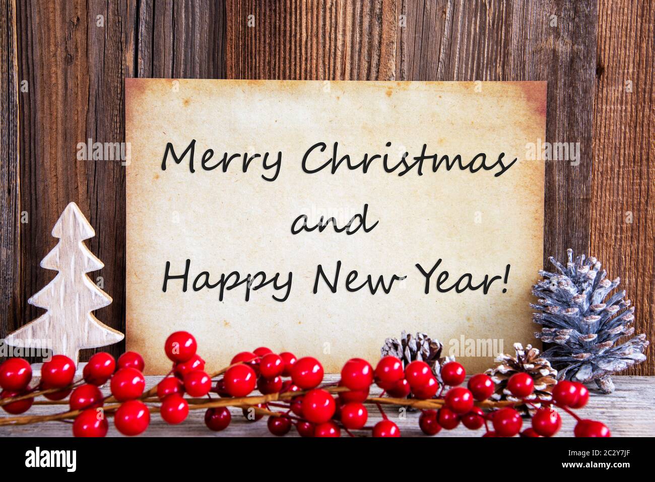 Papier avec texte anglais Merry Christmas and Happy New Yea. Décoration de  Noël et de fond de bois Photo Stock - Alamy