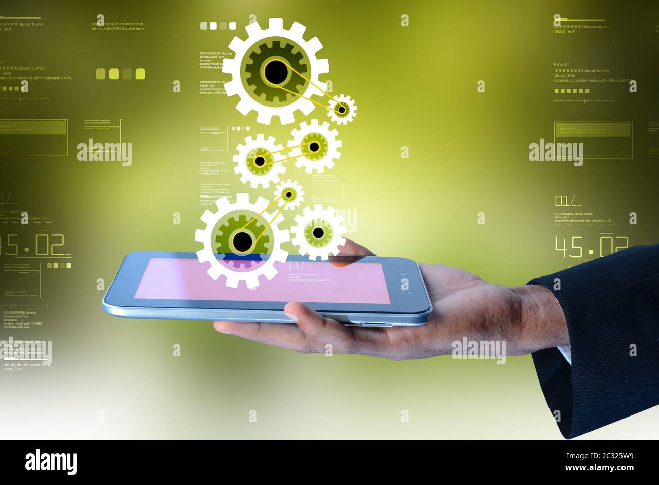 Tablette numérique dans la main et pignons Banque D'Images