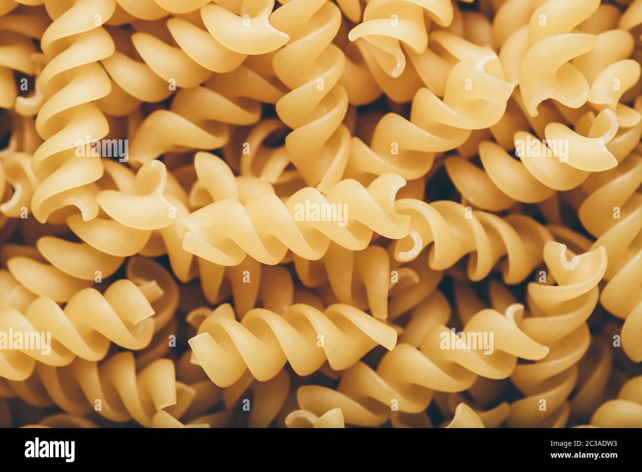 Arrière-plan de blé entier italien pâtes en forme de tire-bouchon Banque D'Images
