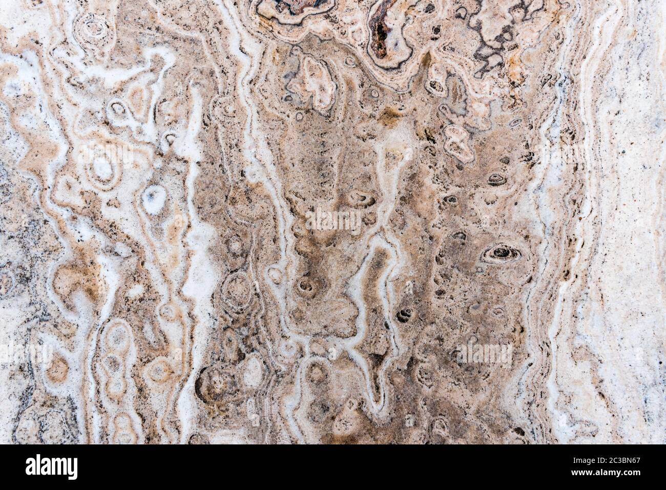 Surface lisse texture de la pierre, blanc ou beige écru à rayures de couleur modèle d'onde de marbre, une structure forte nature durable de rock for abstract zone Banque D'Images