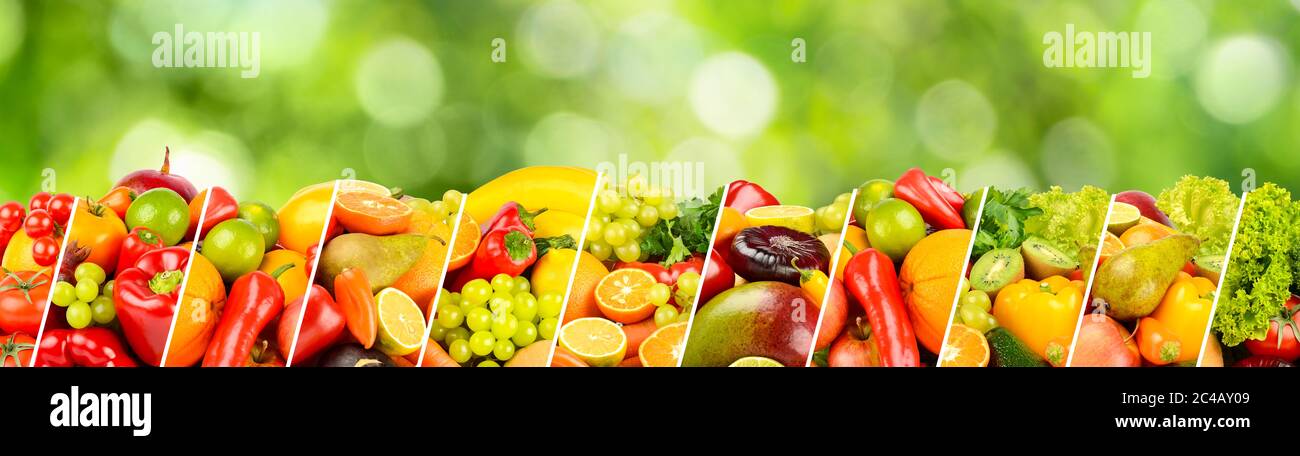 Grande collection panoramique fruits, légumes et baies séparés par des lignes inclinées sur fond vert flou. Banque D'Images