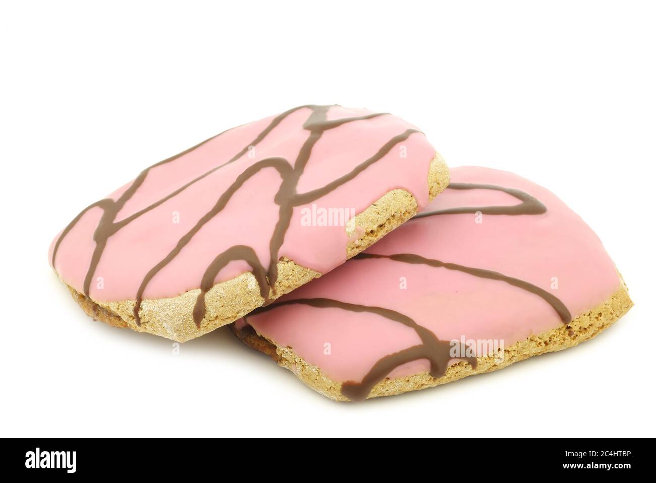 gâteaux fraîchement cuits, roses, avec sauce au chocolat sur fond blanc Banque D'Images