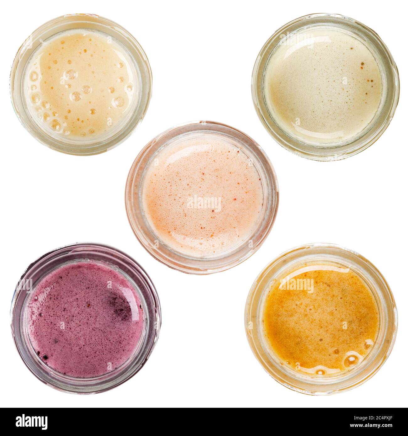 Miel de différents types dans des pots en verre. Isolé sur un fond blanc. Vue du dessus. Banque D'Images