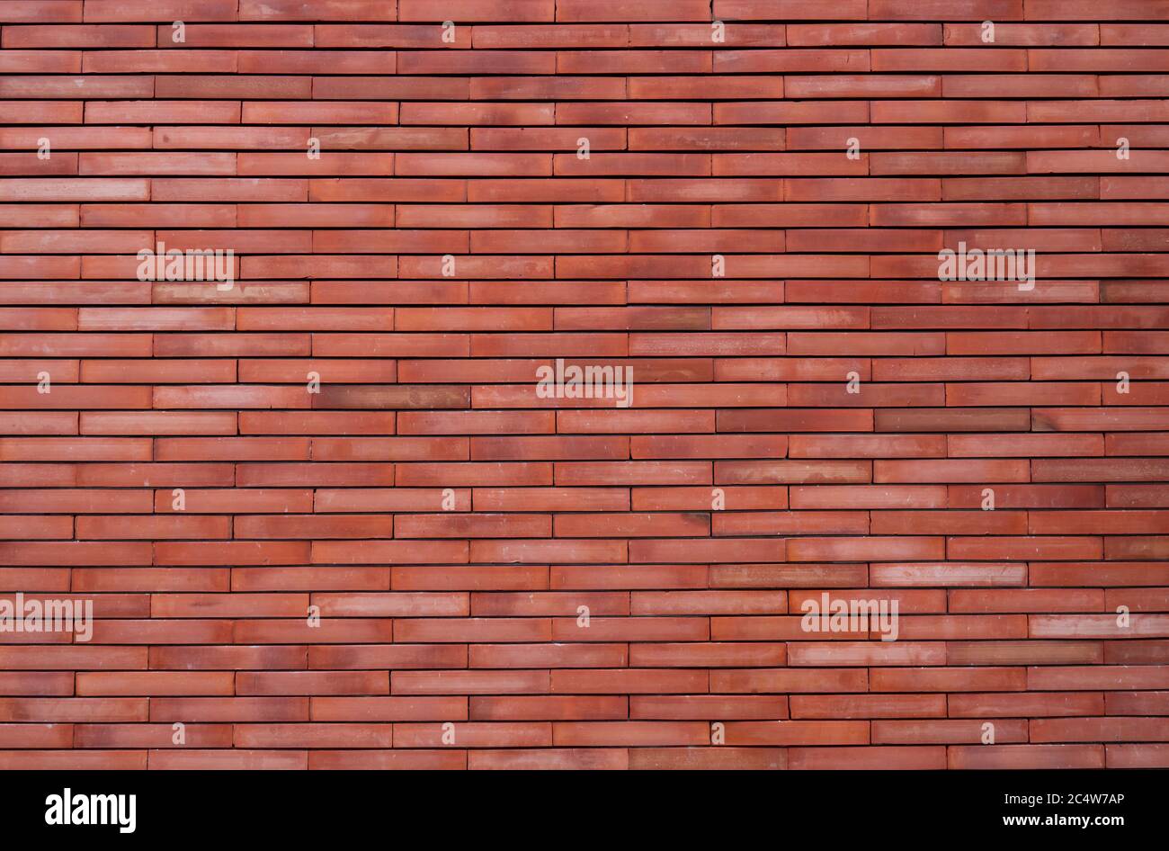 Fond de texture de mur en brique orange. Fond d'écran orange vintage. Mur de briques vide. Fond de mur en brique de couleur orange. Intérieur du mur d'intérieur. Banque D'Images