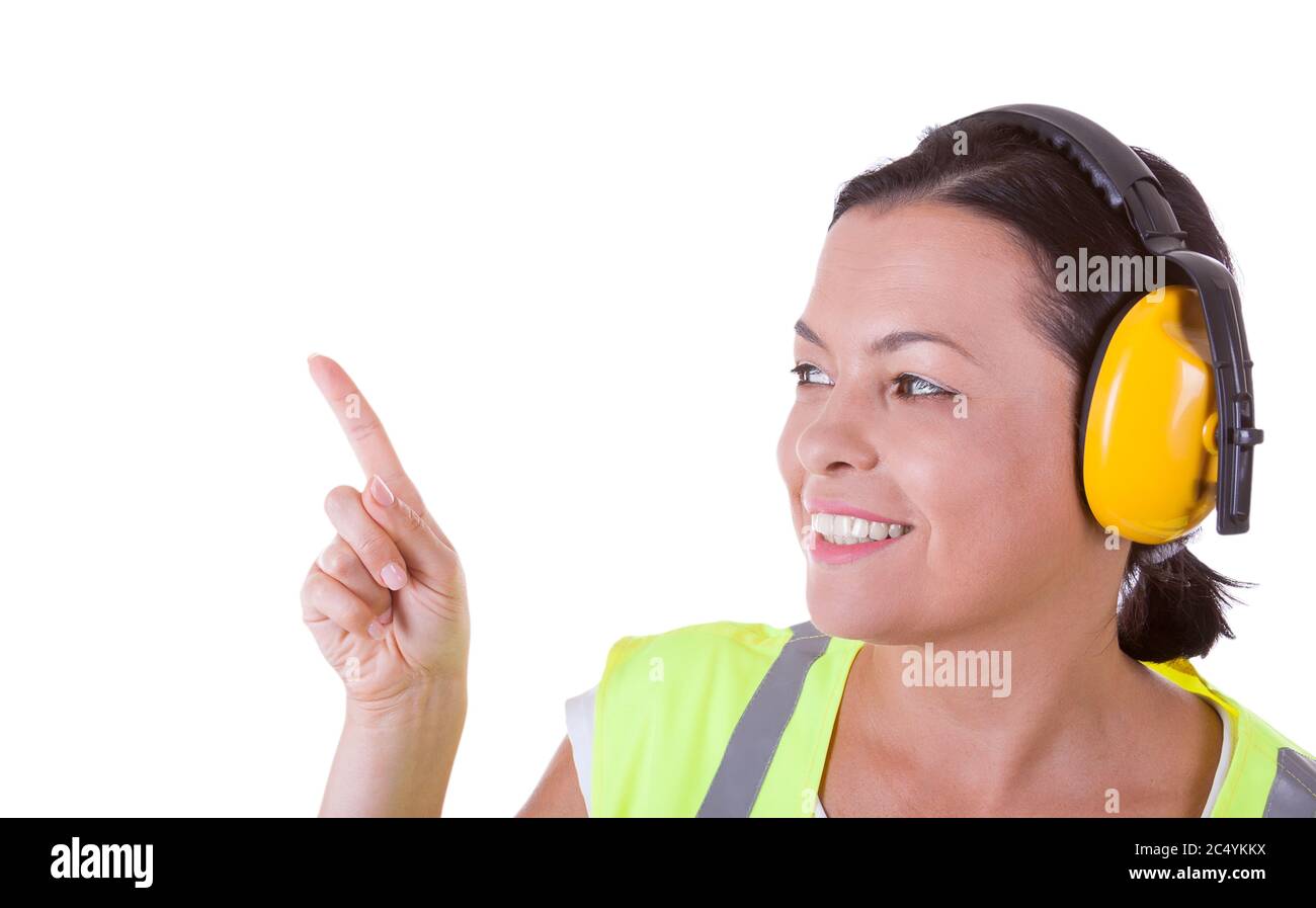 Femme attrayante travailleur dans la veste de sécurité et casque de protection avec CopySpace pour la vôtre Design sur un fond blanc Banque D'Images