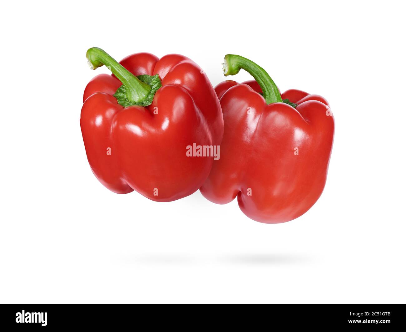 Deux poivrons rouges doux isolés sur fond blanc Banque D'Images