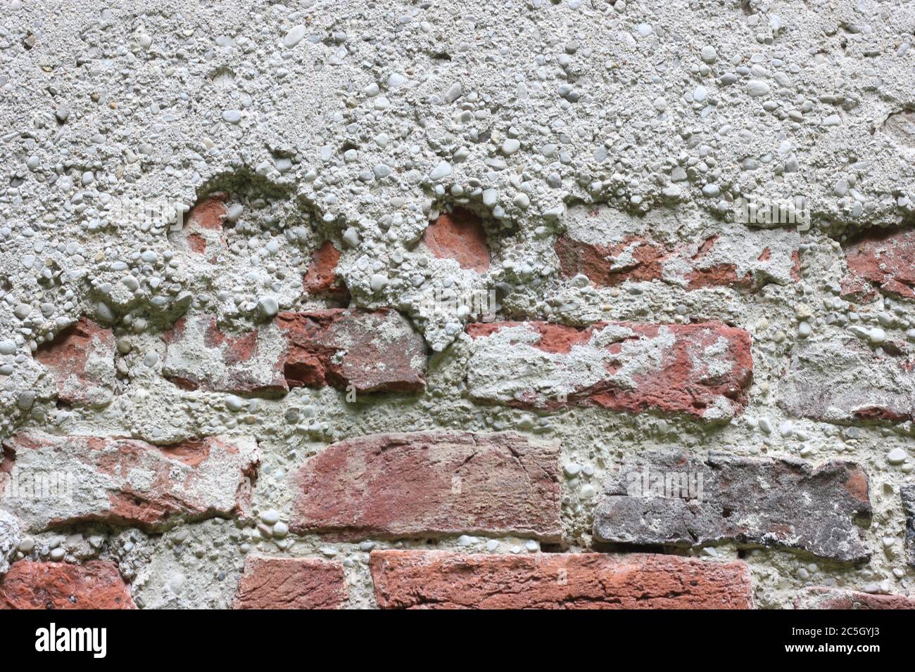 Mur de briques, fond rugueux, plâtre rugueux. Banque D'Images