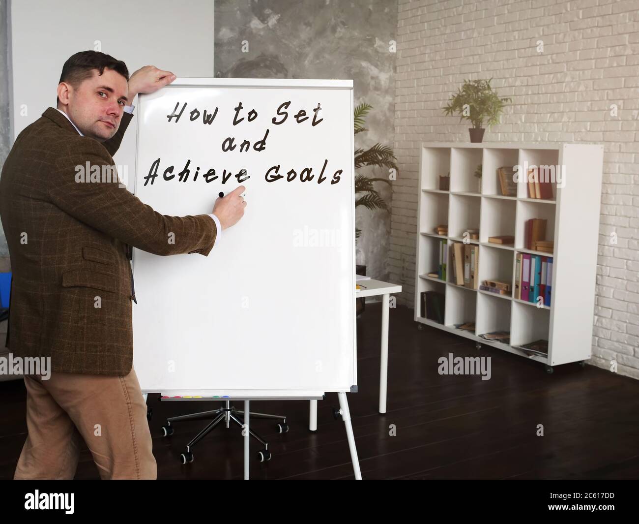 Le mentor écrit Comment définir et atteindre les objectifs. Banque D'Images