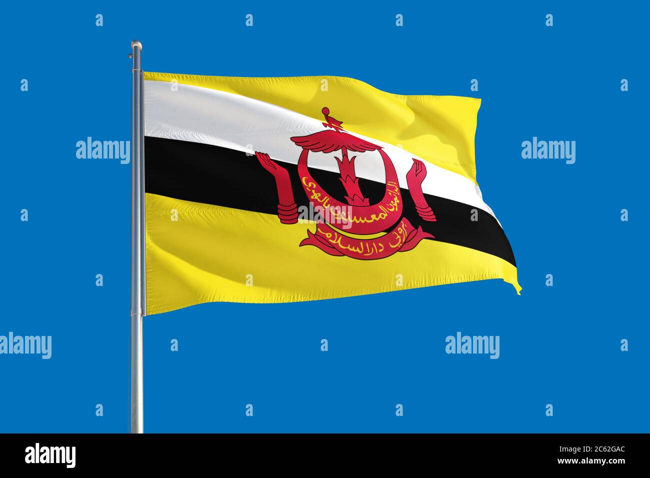 Drapeau national du Brunei agitant dans le vent sur un ciel bleu profond. Tissu de haute qualité. Concept de relations internationales. Banque D'Images