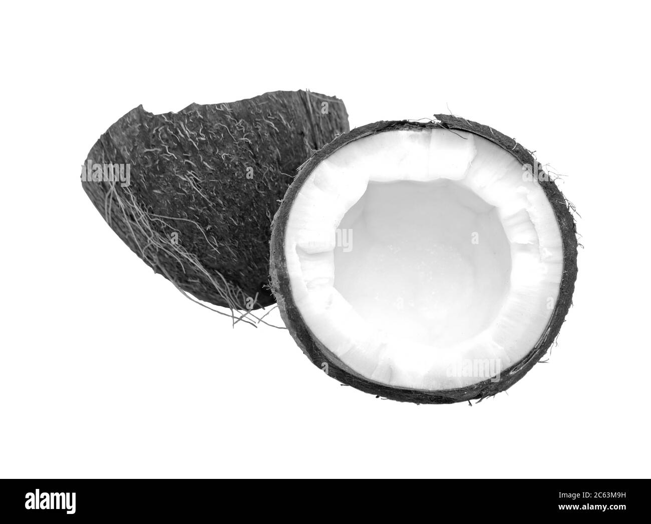La noix de coco est noire et blanche. Moitié de noix de coco isolée sur fond blanc. Vue de dessus Banque D'Images