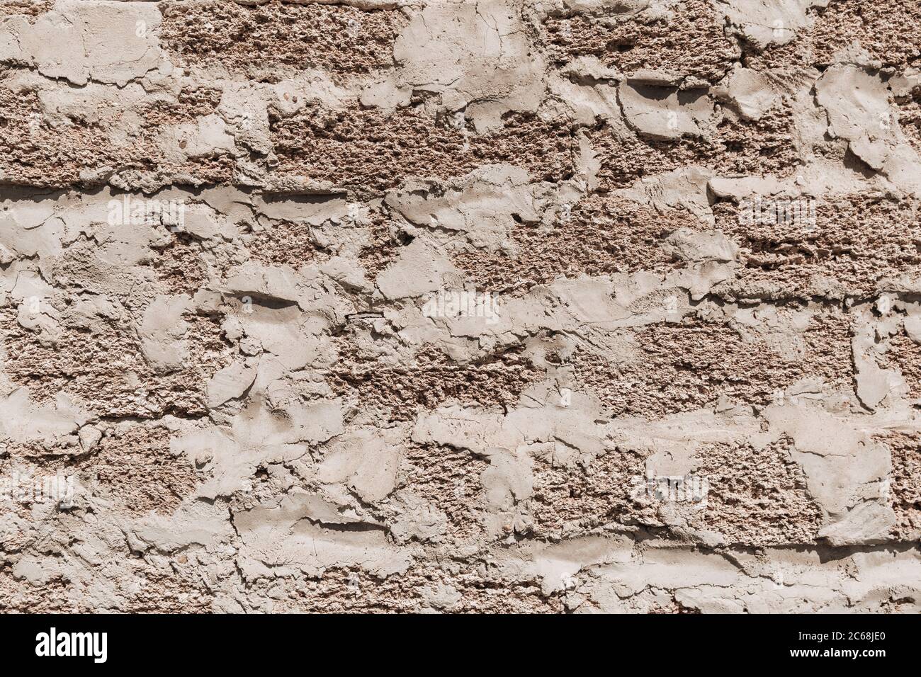 Texture rugueuse d'un mur de briques fait de coques. Banque D'Images