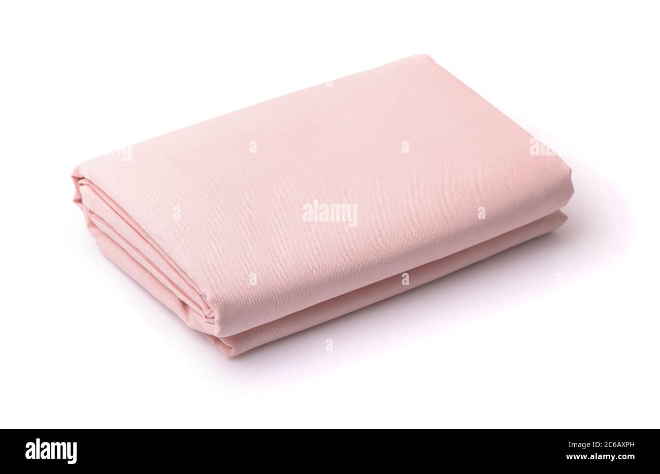 Draps de lit en coton pliés isolés sur du blanc Banque D'Images