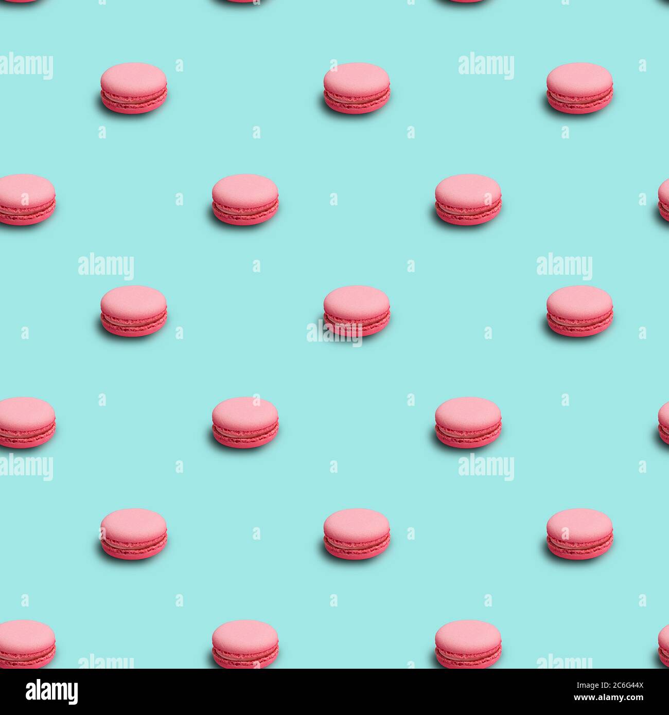 Fond sans couture avec macarons français roses Banque D'Images