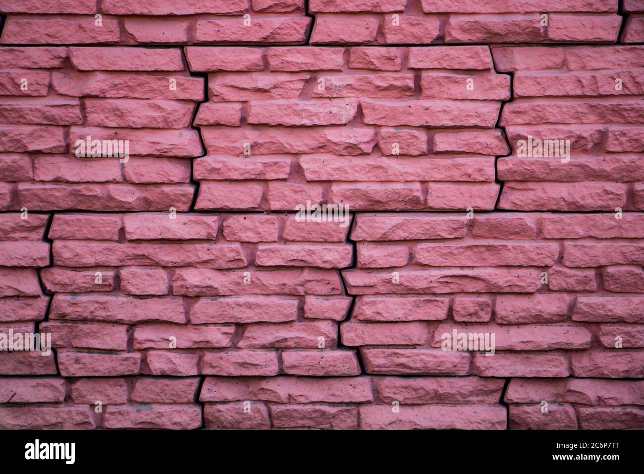 Mur en pierre rose, façade de la maison Banque D'Images