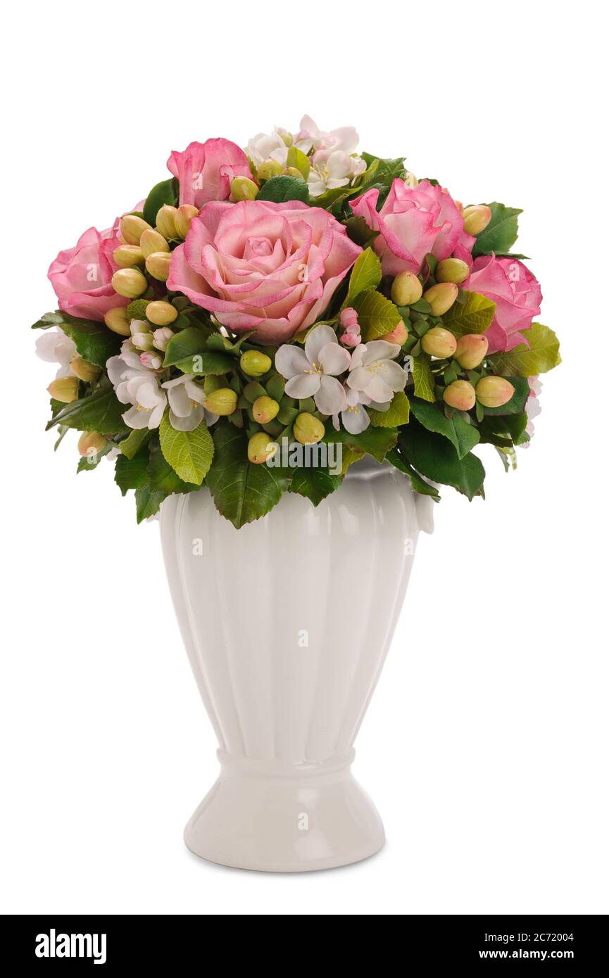 Bouquet de fleurs différentes dans un vase blanc Banque D'Images