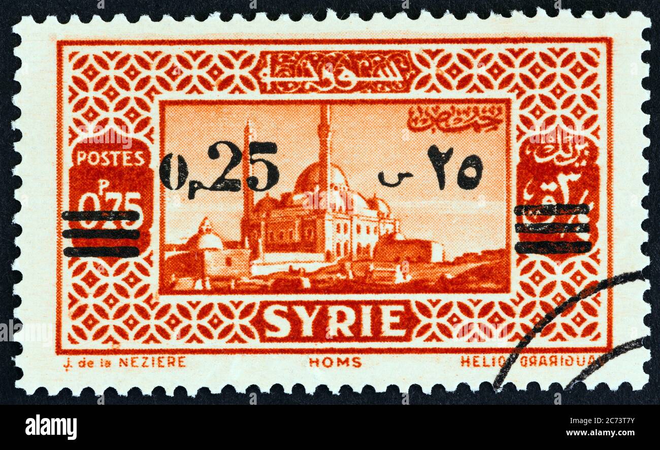 SYRIE - VERS 1938 : un timbre imprimé en Syrie montre Homs, vers 1938. Banque D'Images