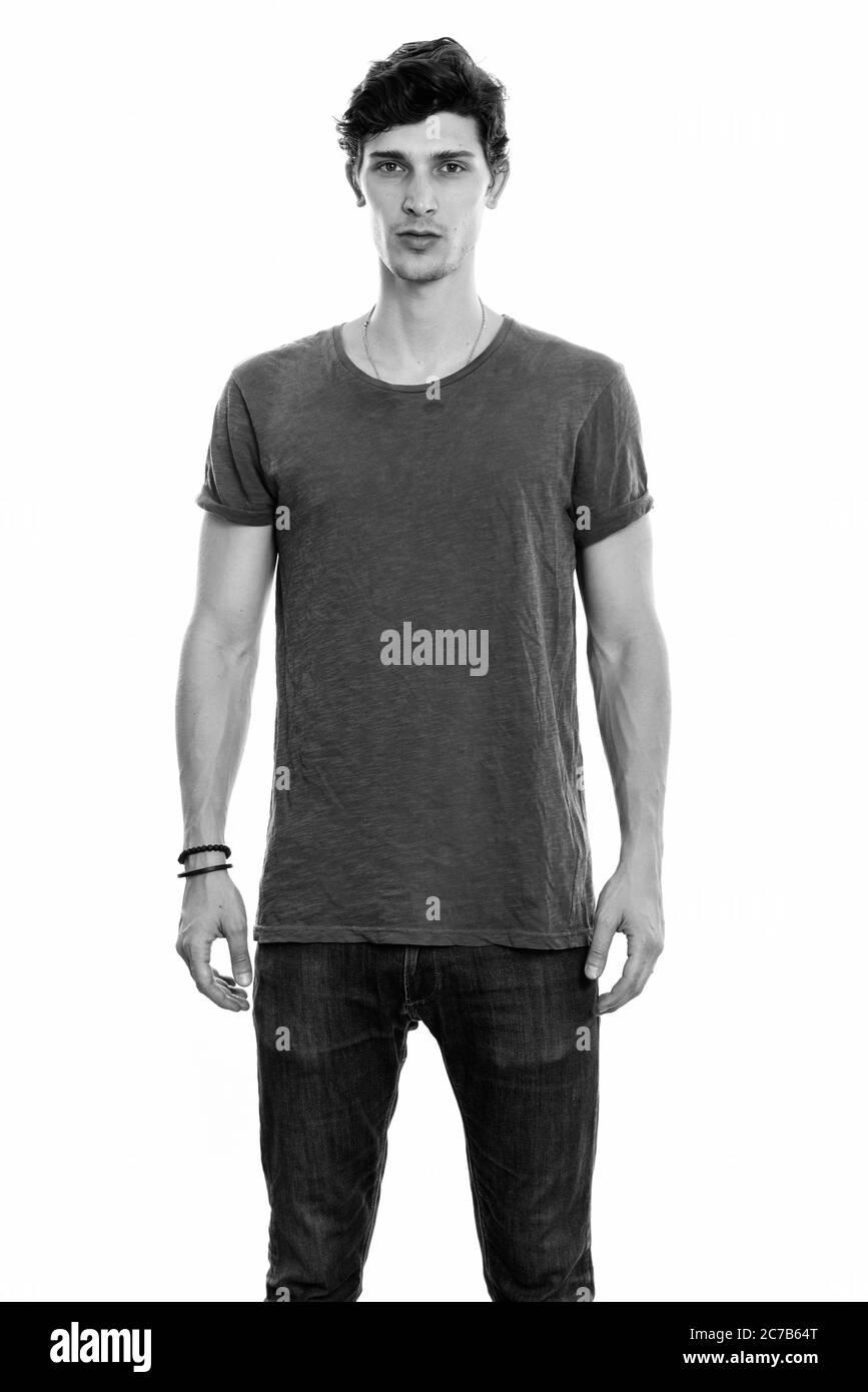 Studio shot of young handsome man standing Banque D'Images Studio shot of young handsome man standing Banque D'Images