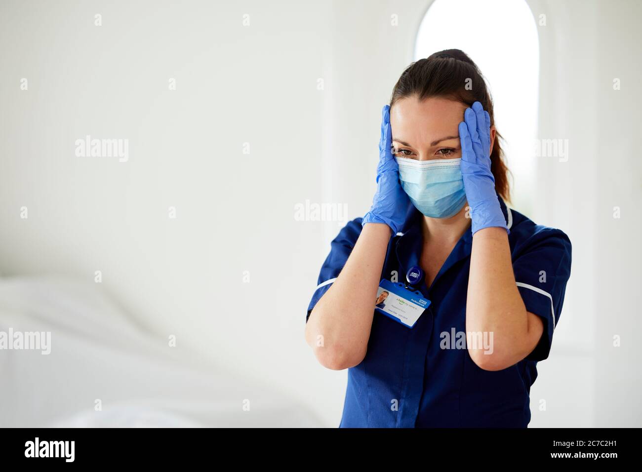 Infirmière stressée au travail Banque D'Images