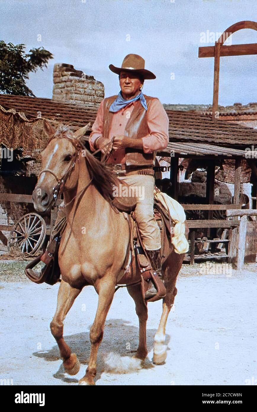 John Wayne comme Taw Jackson dans le chariot de guerre - image de film promotionnel Banque D'Images