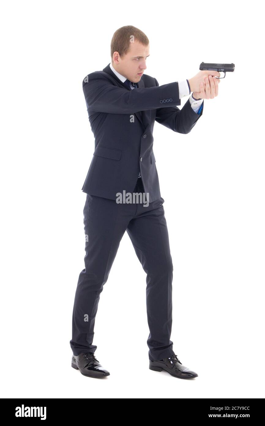agent spécial homme en costume d'affaires posant avec un pistolet isolé sur fond blanc Banque D'Images