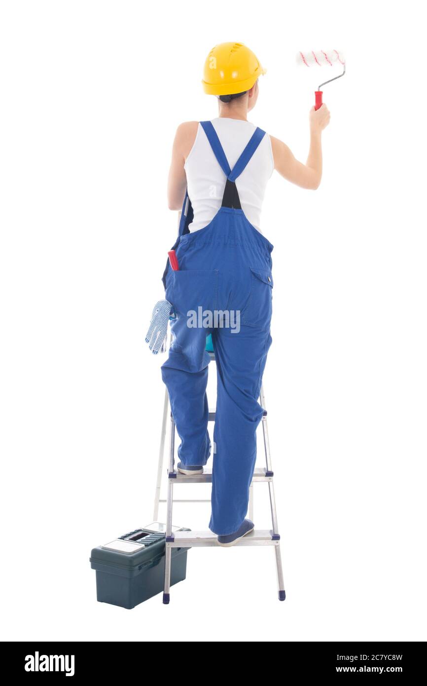vue arrière de la jeune femme peintre en combinaison bleue sur échelle isolée sur fond blanc Banque D'Images vue arrière de la jeune femme peintre en combinaison bleue sur échelle isolée sur fond blanc Banque D'Images