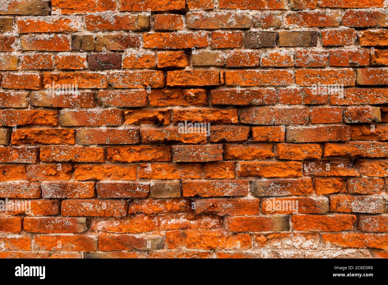 Un vieux mur de briques rouges Banque D'Images
