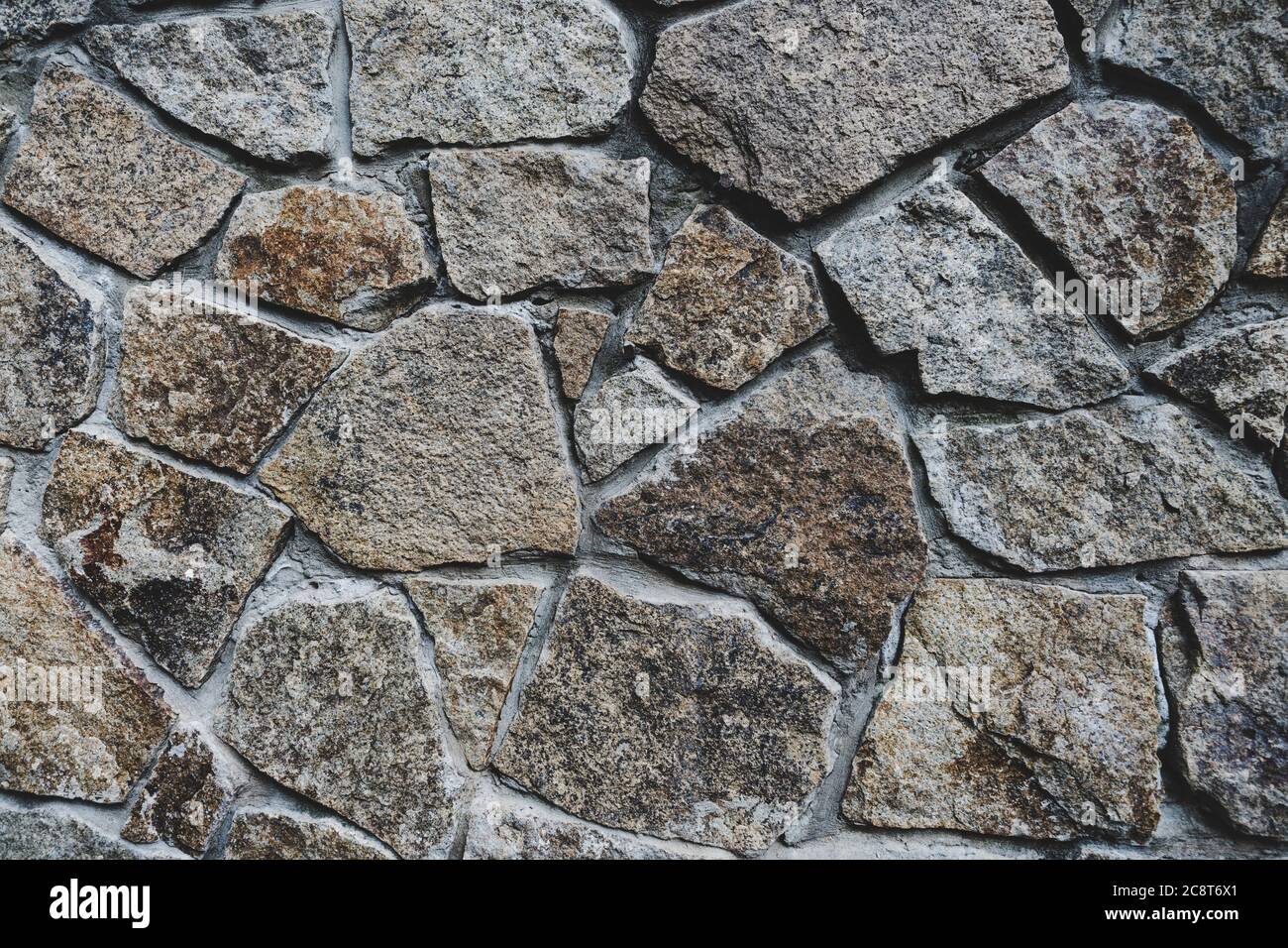 Texture d'arrière-plan de la paroi en pierre. Fragment de mur de pierre ébréchée Banque D'Images