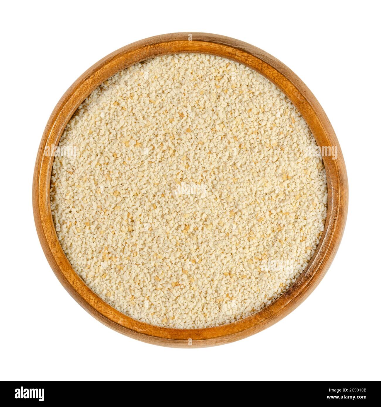 Chapelure fine dans un bol en bois. Les chapelure sèches, appelées ​​residue panure ou chips, sont coupées en tranches de pain sec, utilisées pour le panage ou l'émietté. Banque D'Images