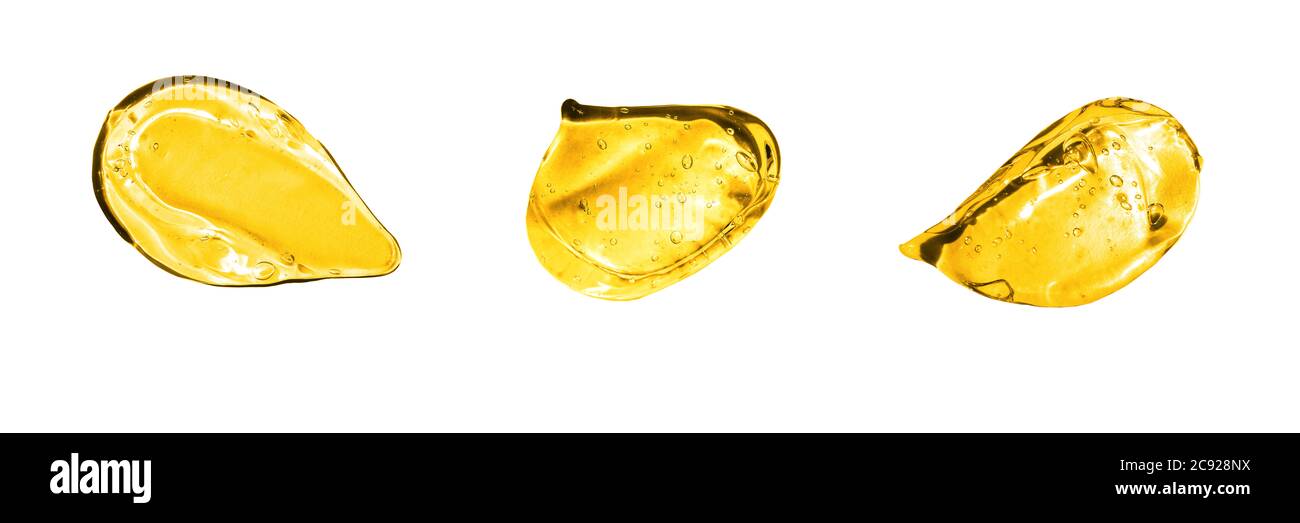 Jeu de traits de gel dorés assortis. Texture du sérum. Gel avec bulles dans le frottis Banque D'Images