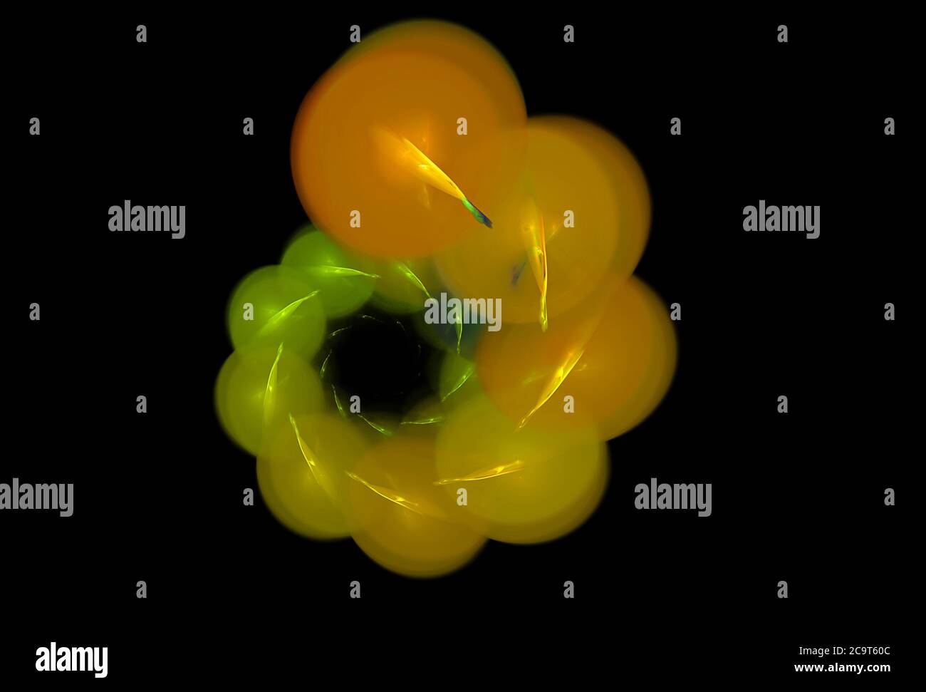 Spirale abstraite d'objets lumineux multicolores sur fond noir Banque D'Images