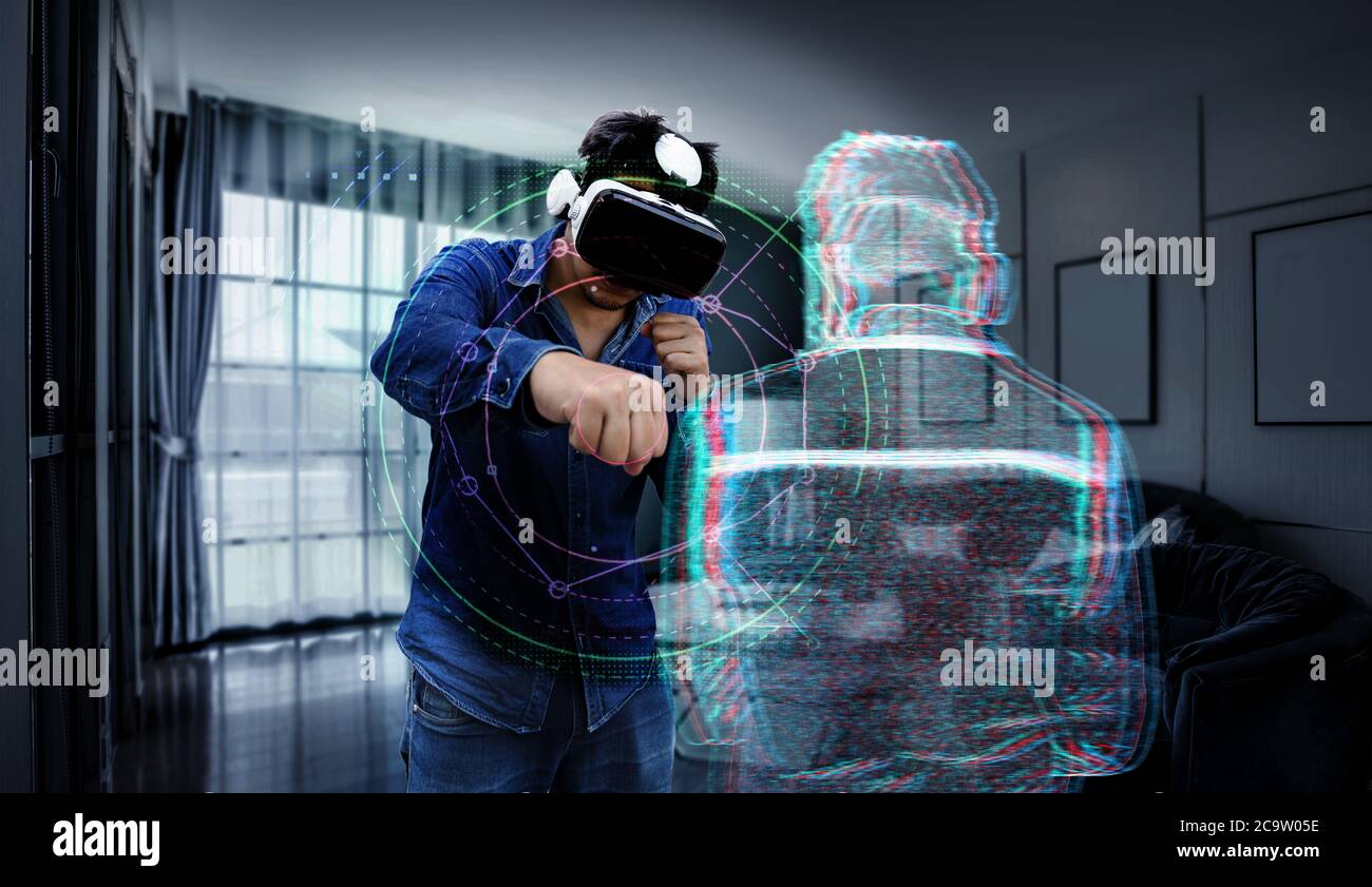 l'homme asiatique porte la technologie des lunettes vr et l'exercice comme sport de boxe avec l'enermy virtuel à la maison avec illustrateur 3d graphique. Banque D'Images