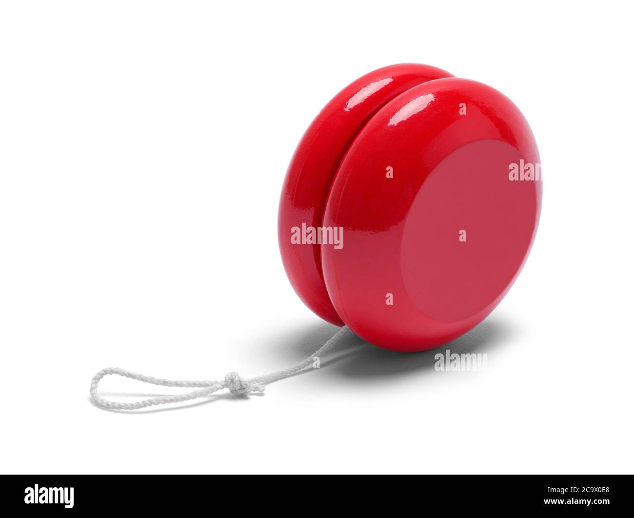Jouet rouge Yo-yo isolé sur fond blanc. Banque D'Images