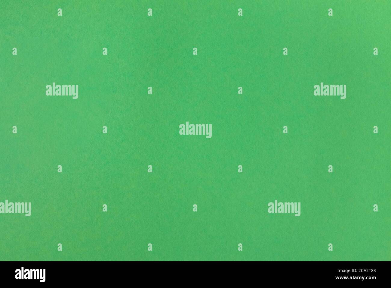 Arrière-plan de texture de papier de couleur verte recyclée. Arrière-plan en carton texturé vert. Texture en carton de couleur herbe pour le design. Structure de Banque D'Images