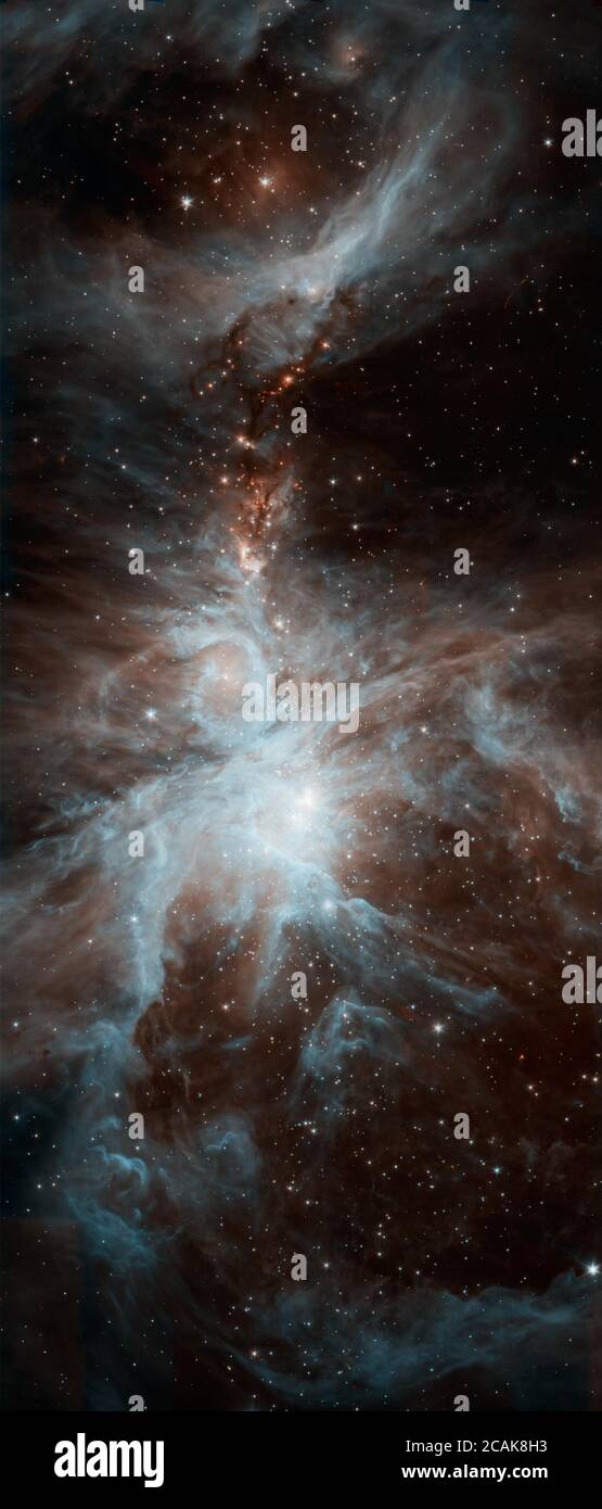 Une colonie de jeunes étoiles chaudes agite la scène cosmique dans cette nouvelle photo du télescope spatial Spitzer de la NASA. L'image montre la nébuleuse Orion, un lieu où naissent les étoiles. Banque D'Images