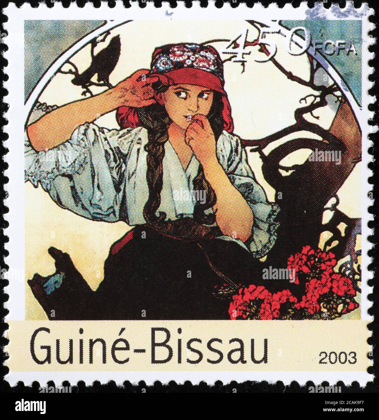 Illustration publicitaire de Mucha sur le timbre de Guinée-Bissau Banque D'Images