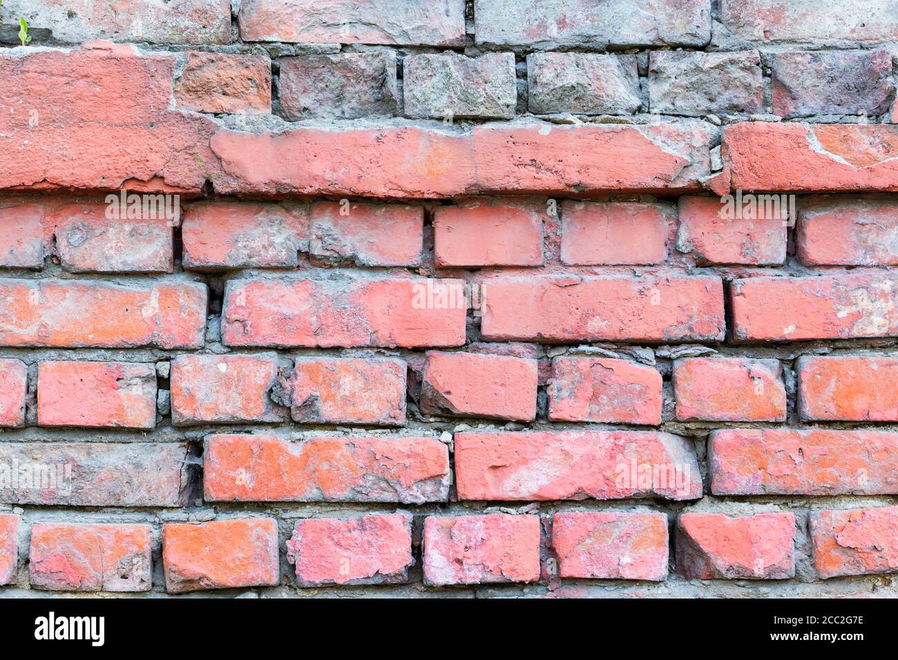 La texture du mur de brique rouge grunge background avec vignetted coins, peuvent utiliser pour la décoration d'intérieur. Banque D'Images