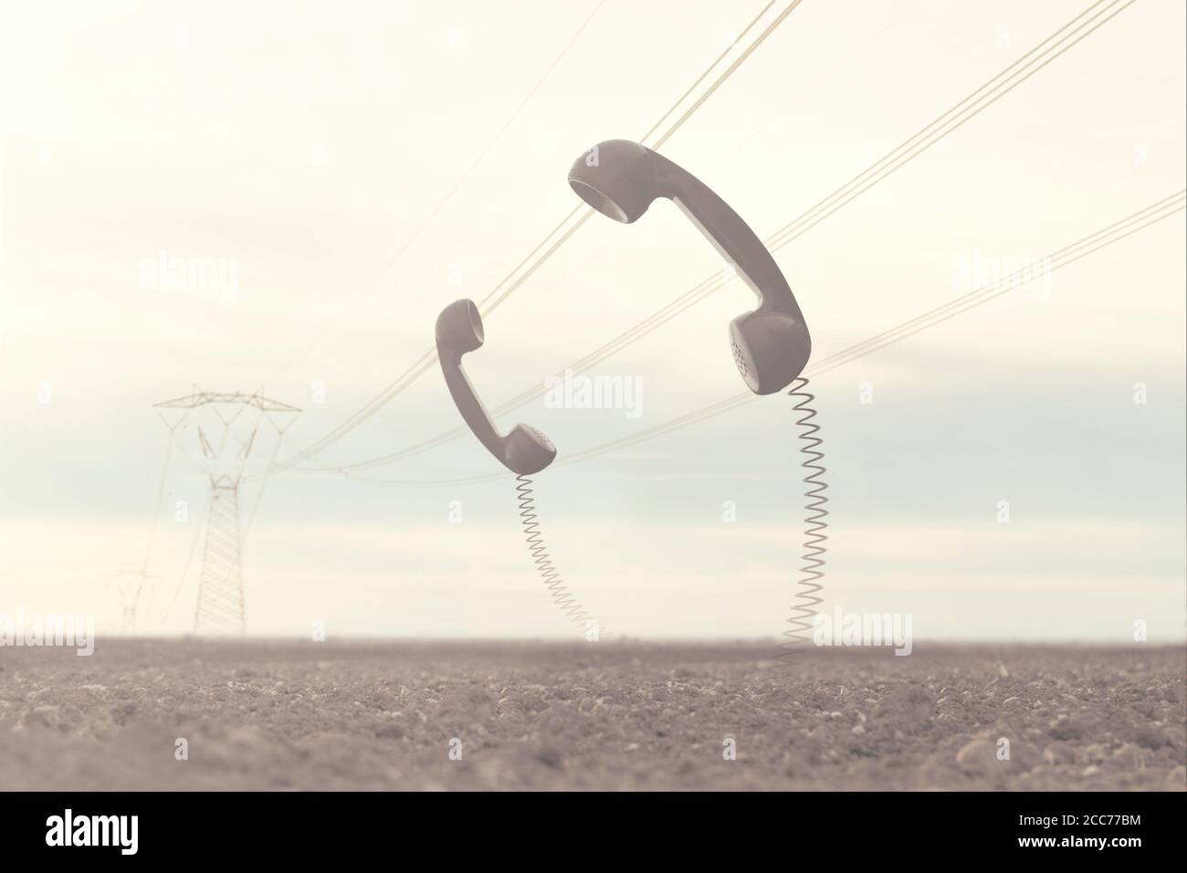 moment surréel entre deux téléphones qui discutent dans le milieu du désert Banque D'Images