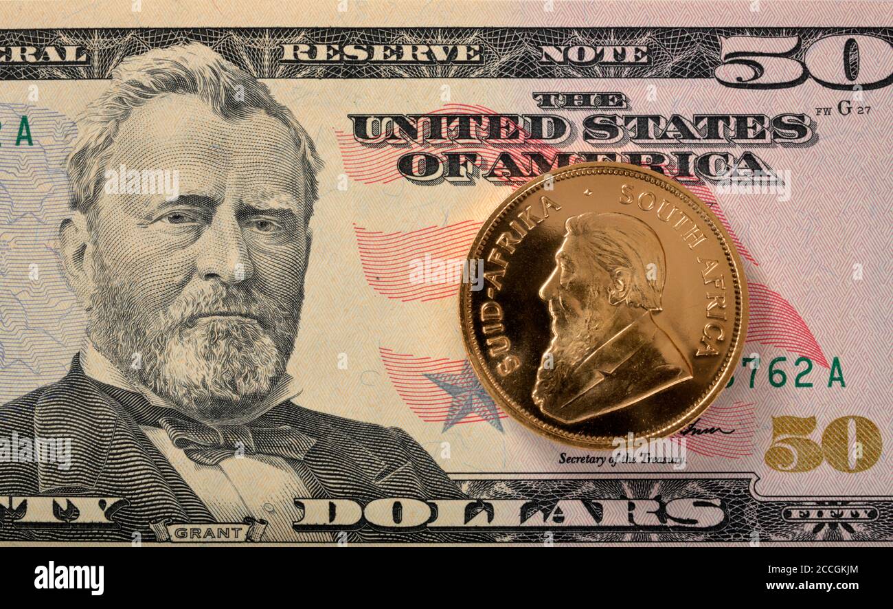 Pièce d'or physique 1 oz or Krugerrand contre Paul Kruger Sur un billet de 50 $ US Banque D'Images