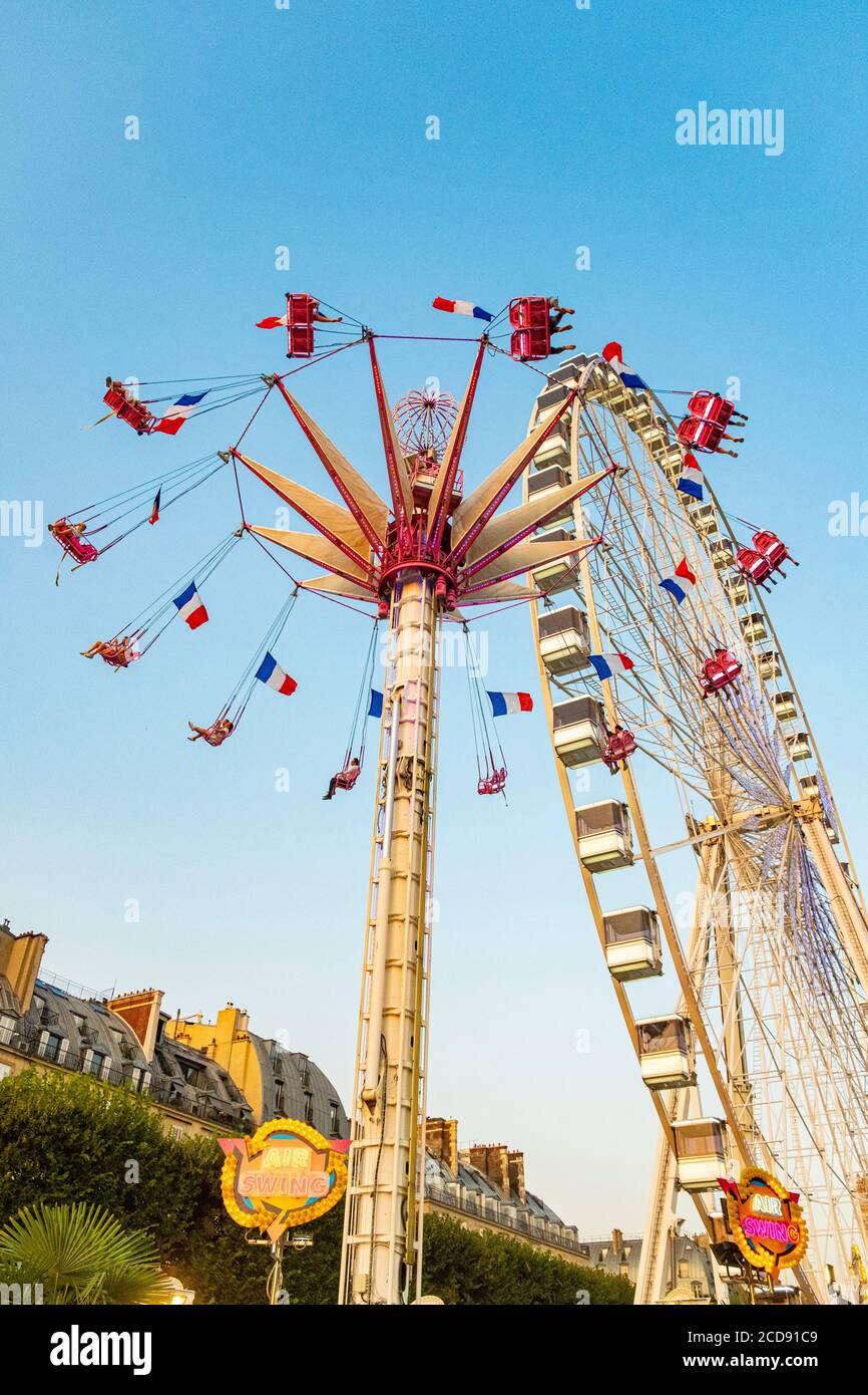 France, Paris, jardin des Tuileries, Foire, Carousel et Grande roue Banque D'Images