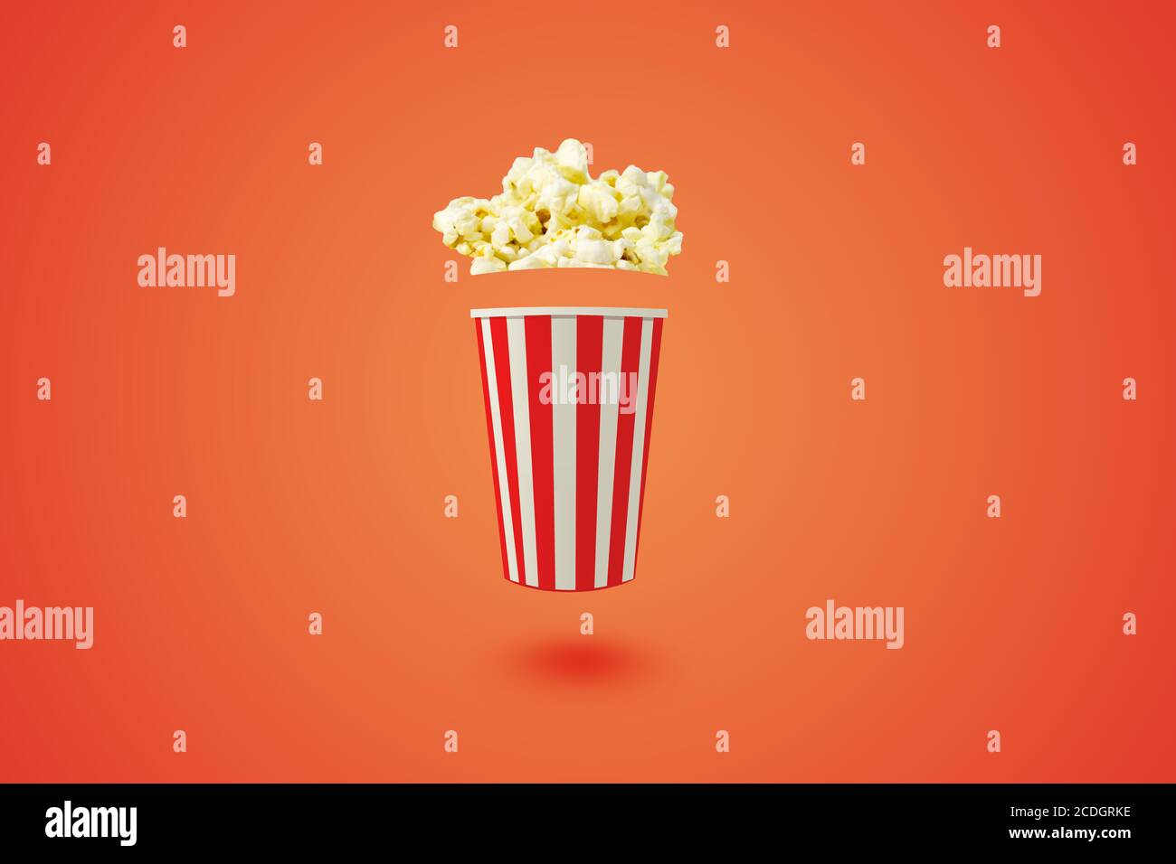 Popcorn volant 3D sur fond d'éclairage orange: Cinéma concept minimal : illustration 3D Visualisation professionnelle de la créativité Banque D'Images
