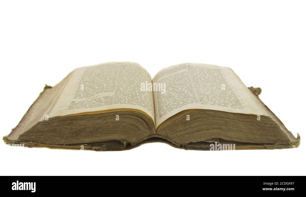 Vintage old book bible ouverte en lecture isolated on white Banque D'Images