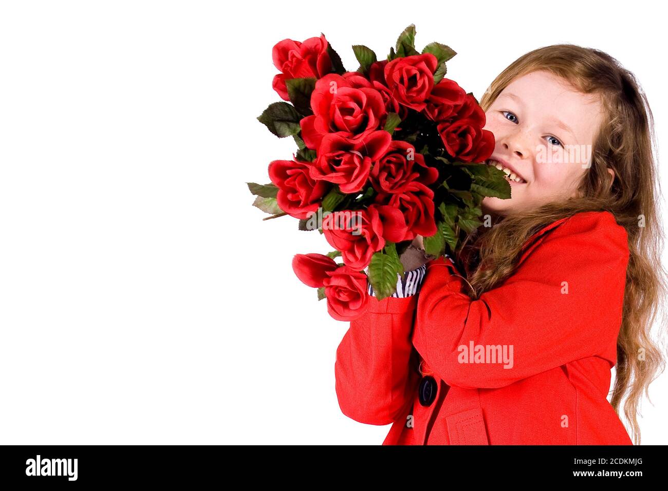 Petite fille douce avec des roses Banque D'Images